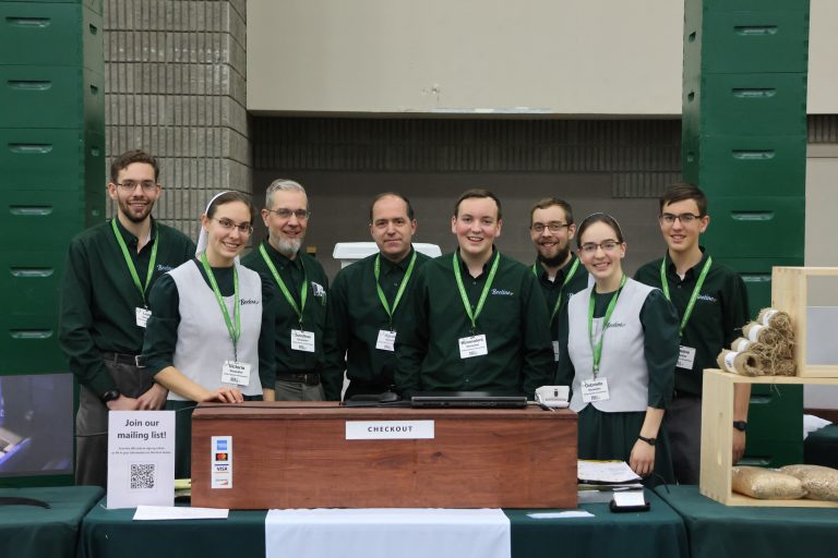 The Beeline Management poses for a moment at the North American Honeybee Expo in 2024.