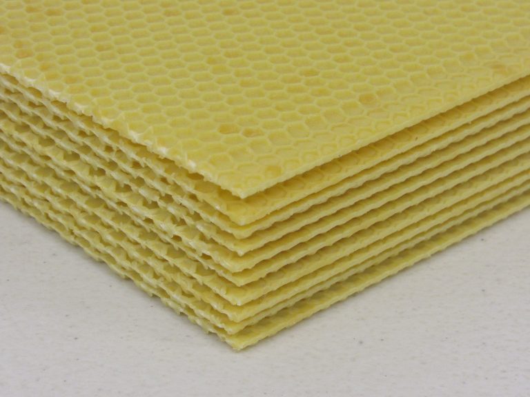 A stack of plastic yellow hive foundation.